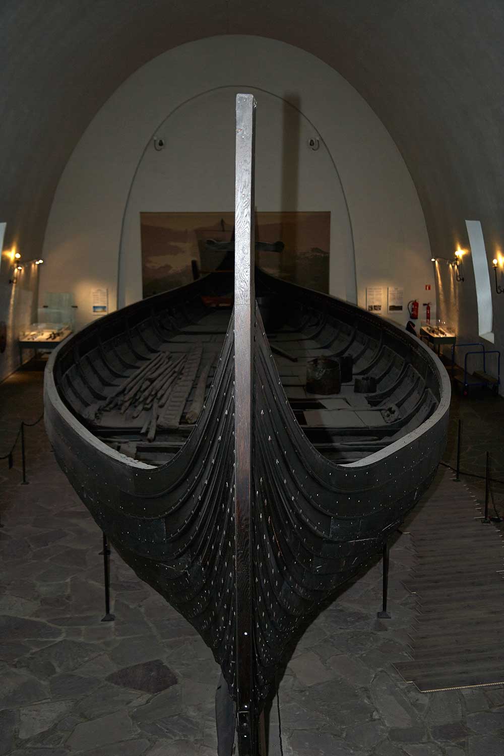 A viking ship on display in an exhibition