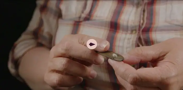 Close-up of a person practicing nålebinding.