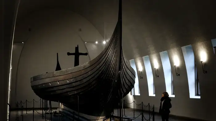A Viking ship on display in an exhibition.